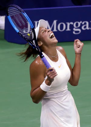 Madison Keys celebrates after defeating Carla Suarez Navarro, 6-4, 6-3 in Wednesday's quarterfinals at the U.S. Open. [Adam Hunger/The Associated Press]