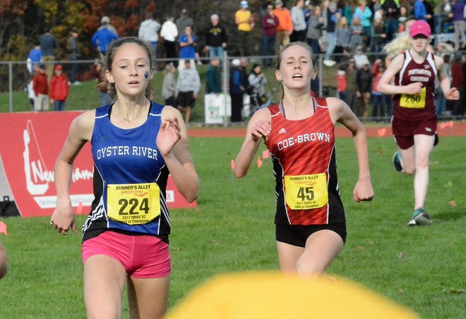 Oyster River's Olivia Lenk, left, outduels Coe-Brown's Abigail O'Connor and Portsmouth Christian's Liza Corso during the 2017 Meet of Champions in Nashua. [Mike Whaley/Fosters.com]