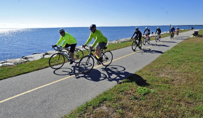 Riders round the bend at Fort Taber Park heading to water stop during the annual Buzzards Bay Watershed Ride last year. [DAVID W. OLIVEIRA/STANDARD-TIMES SPECIAL/SCMG]
