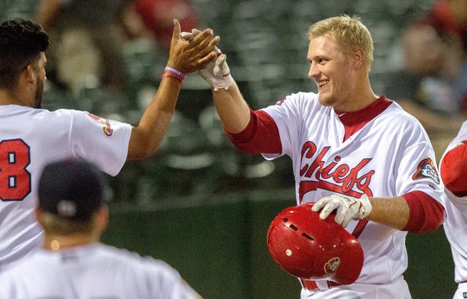 MATT DAYHOFF/JOURNAL STAR Luken Baker, right, of the Chiefs celebrates his two-run homer in the fourth inning against the Quad Cities River Bandits on Wednesday, Sept. 5, 2018 at Dozer Park in Peoria.