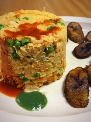 Chicken and rice at Tropico Latino restaurant. [ERIC PERA/THE LEDGER]