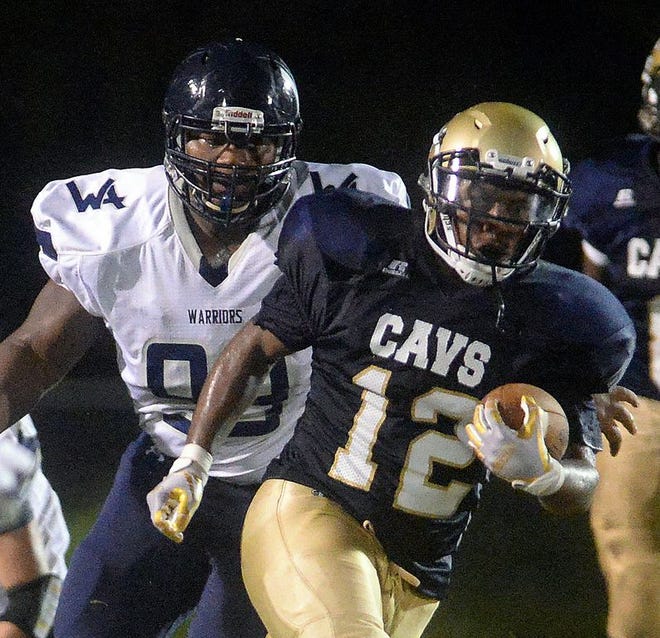 Cummings' Tyrese Crisp, right, carries the ball as Western Alamance's Javontay Edwards pursues in last week's game.