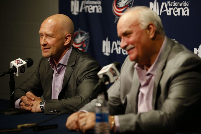 Jarmo Kekalainen, general manager of the Columbus Blue Jackets, left, answers a question as John Davidson, president of hockey operations, right, smiles during an end-of-season press conference on Monday, April 24, 2017 at Nationwide Arena in Columbus, Ohio. [Joshua A. Bickel/Dispatch]