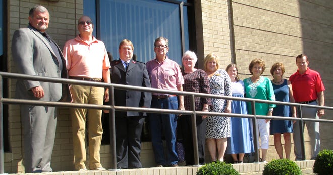 Jeff East, left, representing the Guernsey County Foundation, and John Davis, second from left, representing the John W. and Edna McManus Shepard Fund, pose with representatives of grant recipients. They are, left to right, Capt. Ed McMillen, The Salvation Army; Steve Connell and Beth Wharton, Guernsey County Genalogical Society; Lorraine Teague, Hospice of Guernsey; Margurit Black, S.A.L.T. Factory Teen Center; Carol Wilcox-Jones, Salt Fork Arts & Crafts Festival; Julie Davies, Dickens Victorian Village; and Norm Blanchard, Cambridge-Guernsey County Community Improvement Corporation.