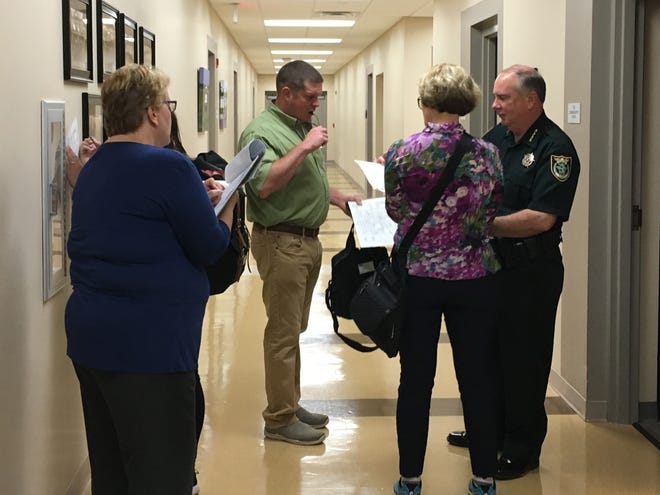 Flagler County Sheriff Rick Staly talks with members of a team from the U.S. Centers for Disease Control and Prevention during their visit to the sheriff's Operations Center in Bunnell on Thursday morning. [Photo provided/FCSO]