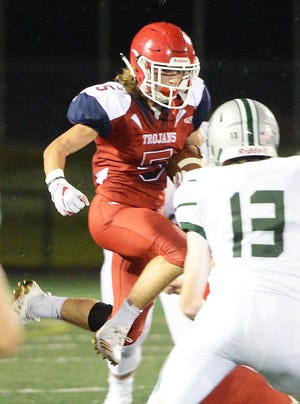 Bridgewater-Raynham runningback William Lombard carries the football on the ground during Thursday's game against Duxbury on Sept. 6, 2018. 

(Marc Vasconcellos/The Enterprise)
