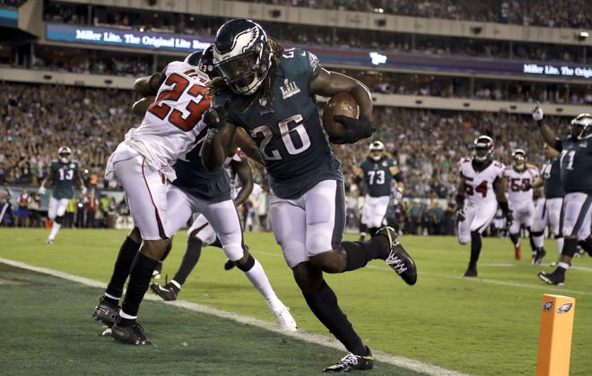 Philadelphia Eagles' Jay Ajayi scores what proves to be the game-winning touchdown against the Atlanta Falcons late in the fourth quarter Thursday night. It was Ajayi's second touchdown of the game. [The Associated Press]