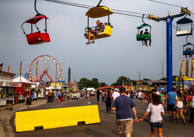 JUSTIN L. FOWLER/GATEHOUSE MEDIA ILLINOIS Fairgoers take in the sights and sounds on the final day of the Illinois State Fair in August.