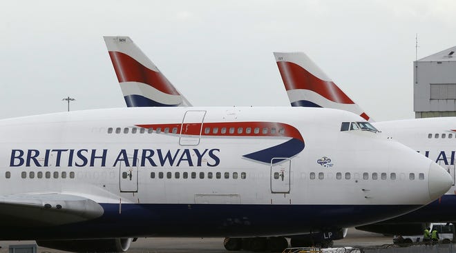 FILE - In this file photo dated Tuesday, Jan. 10, 2017, British Airways planes are parked at Heathrow Airport in London. ÔªøÔªøÔªøÔªøÔªøÔªøÔªøÔªø British Airways announced a "very sophisticated malicious criminal attack" on its website Thursday Sept. 6, 2018, that compromised personal credit card information of its customers, and Chief Executive Alex Cruz said Friday the company is "100 percent committed" to compensating customers whose financial information was stolen. (AP Photo/Frank Augstein, FILE)