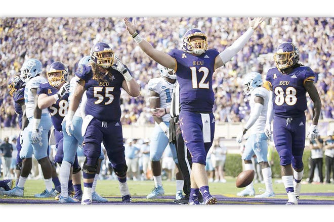 ON THEIR WAY — East Carolina quarterback Holton Ahlers (12) celebrates after scoring a touchdown in the second quarter against North Carolina.