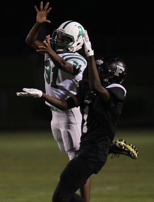 Ashbrook's Larry Holland breaks up a pass intended for Forestview's Jamarion Dawkins Friday night to open up Big South Conference play. [Brian Mayhew / Special to the Gazette]