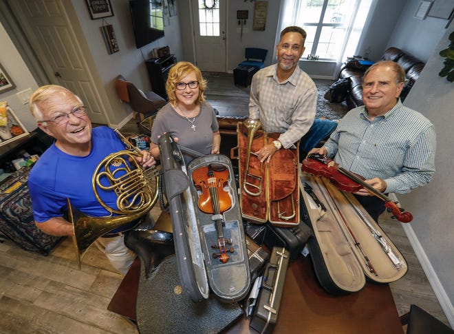 Cliff Jensen, left, Bonnie Barker, Manuel Rios and Jim Weaver, all Lake Wales Breakfast Rotary Club members, with instruments and accessories that they will be taking to Honduras. Bonnie Barker and her husband Keith Barker support a rescue home for children in Honduras. [PIERRE DUCHARME/THE LEDGER]