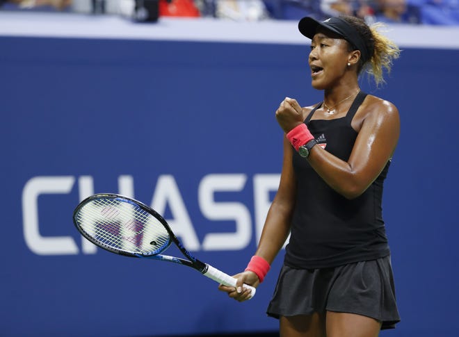 Naomi Osaka, reacts after breaking the serve of Serena Williams during the women's final of the U.S. Open on Saturday in New York. [ADAM HUNGER/THE ASSOCIATED PRESS]