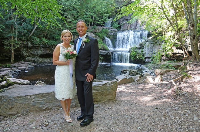 Recently married Out & About columnist Rick Koval stands beside his bride Wendy near Indian ladder Falls at Skytop Lodge. Rick finally became Wendy’s hubby instead of her hobby as hinted by many of his readers. [Ron Dickey Photo]