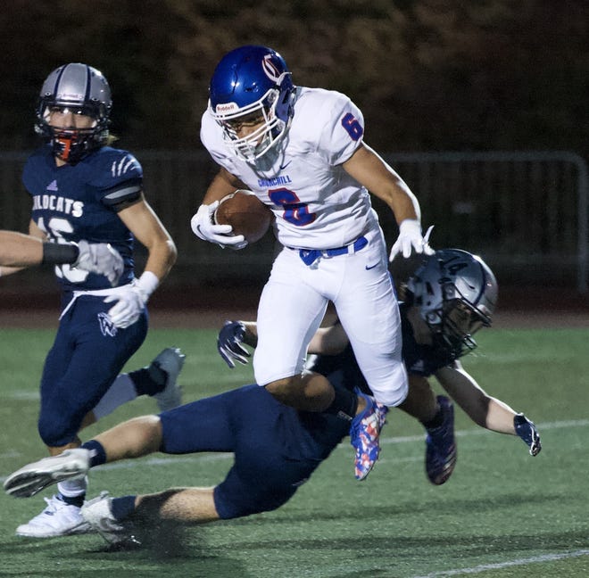 Churchill receiver Elijah Fields goes airborne for a big gain for Churchill Friday night against Wilsonville. (Norm Maves/For The Register-Guard]
