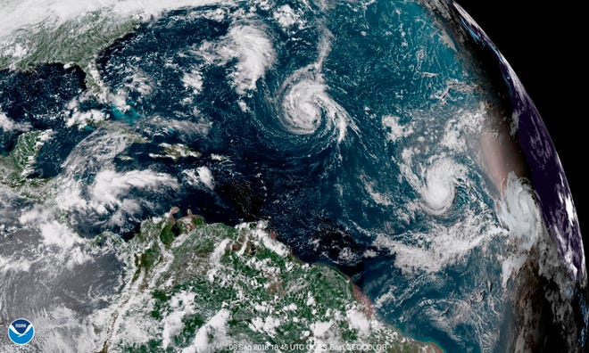 Tropical Storm Florence, center, moves in the Atlantic Ocean at 2:45 p.m. Saturday. [NOAA via AP]