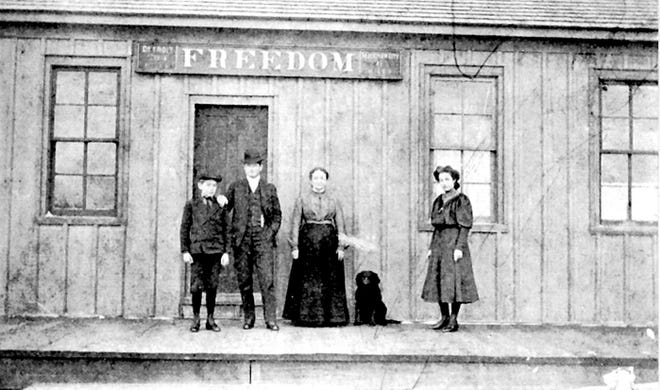 The Freedom railroad station, with Stationmaster Joseph Asselin and his family.