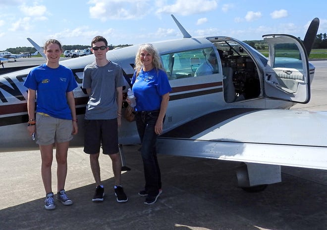 EAA Chapter 534 Aviation Youth members Caela Mazenko and William McCarthy and EAA volunteer Fay Craft get ready for takeoff. [Submitted]