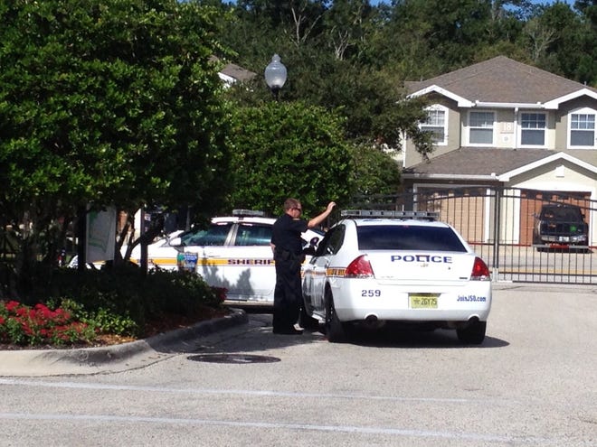 Jacksonville police evacuated some residents of The Cottages at Argyle condominium complex Sunday after an early morning shooting. [Teresa Stepzinski/Florida Times-Union]