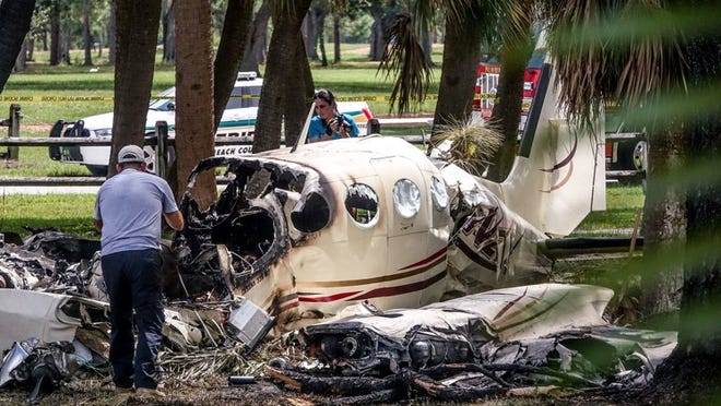 A plane crash at John Prince Park, Lake Worth, Sunday, September 9, 2018. Two people are confirmed dead. (Melanie Bell / The Palm Beach Post)