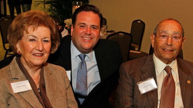 Richard DeVos is pictured at a Palm Beach Atlantic University Alumni Awards Dinner with Ben Starling and his wife, Helen.