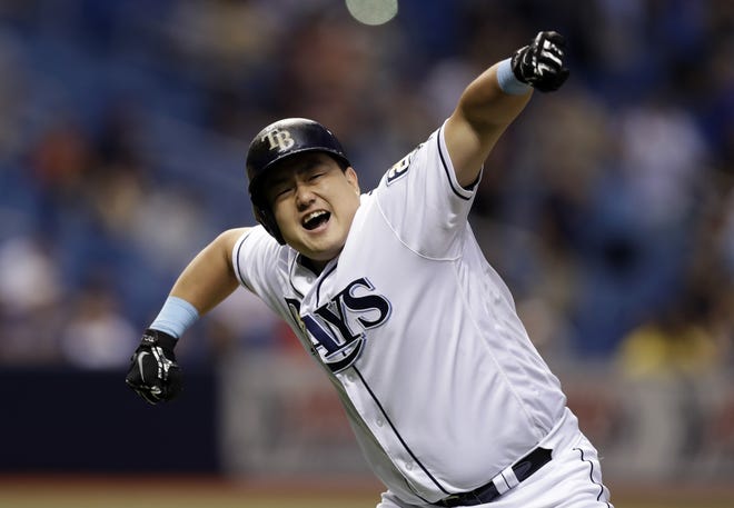 Tampa Bay Rays' Ji-Man Choi celebrates his two-run walk off home run off Cleveland Indians pitcher Brad Hand during the ninth inning Monday in St. Petersburg. The Rays won the game 6-5. [The Associated Press / Chris O'Meara]