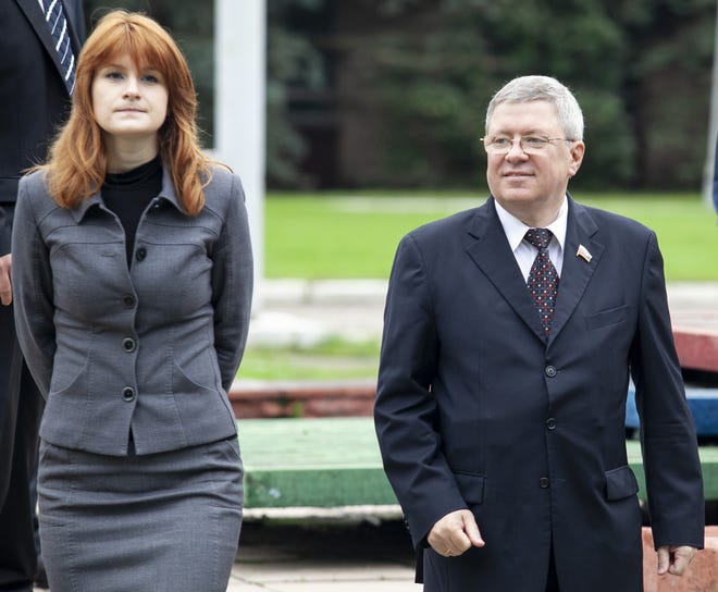 In this photo taken on Friday, Sept. 7, 2012, Maria Butina walks with Alexander Torshin then a member of the Russian upper house of parliament in Moscow, Russia. Accused of working as a foreign agent, Butina faces a hearing Monday, Sept. 10 in Washington. [AP Photo/Pavel Ptitsin]