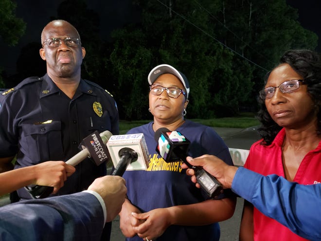 Superintendent Diana Greene (center), Duval County Director of School Police Micheal Edwards and School Board Chairwoman Paula Wright discuss the shooting after a recent Raines-Lee football game. [Dan Scanlan/Florida Times-Union]