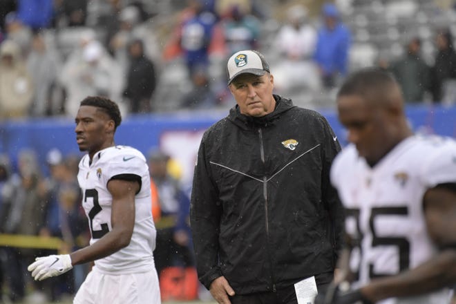 Jacksonville Jaguars head coach Doug Marrone, center, watches his team warm up before of an NFL football game against the New York Giants Sunday, Sept. 9, 2018, in East Rutherford, N.J. (AP Photo/Bill Kostroun)