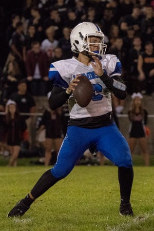 Sophomore quarterback J.C. Cora looks to make a pass down the field. [MELONY LETARTE PHOTO]