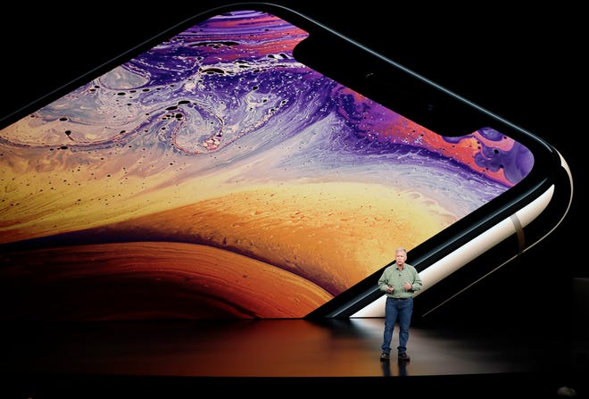 Phil Schiller, Apple's senior vice president of worldwide marketing, speaks about the Apple iPhone XS at the Steve Jobs Theater during Wednesday's event to announce new Apple products in Cupertino, Calif. [AP photo / Marcio Jose Sanchez]