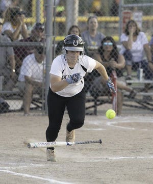 South's Stevi Nichols runs up the line after bunting Tuesdya during the Colts' 7-6 victory in eight innings over Pueblo County. [CHIEFTAIN PHOTO/ZAACHARY ALLEN]