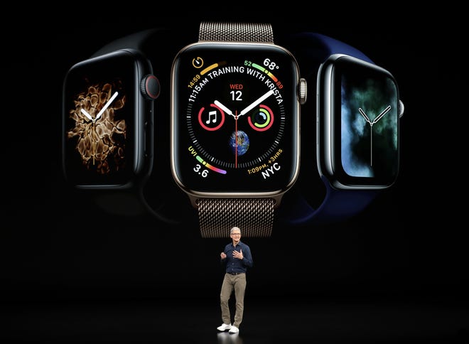 Apple CEO Tim Cook discusses the new Apple Watch 4 at the Steve Jobs Theater during an event to announce new products Wednesday, Sept. 12, 2018, in Cupertino, Calif. (AP Photo/Marcio Jose Sanchez)