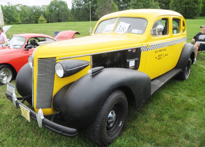 One car that received a lot of reaction at the Ferris Hills and Clark Meadows Car Show on Thursday in Canandaigua was this 1937 Buick Taxi, owned by Ray and Pam Sitter.

[Jack Haley/Messenger Post Media]