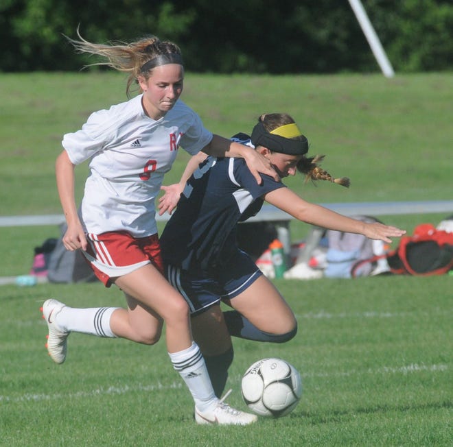 Brookeln Hanley of Red Jacket works to get the ball away from Nichaela Commisso of Marcus Whitman. (Jack Haley/Messenger Post Media)