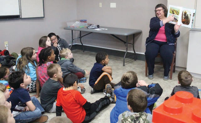 Children’s Librarian Suzanne Kestel reads a story during a spring program at the Perry Public Library. Fall storytime sessions will begin Sept. 18. PHOTO BY ALLISON ULLMANN/THE PERRY CHIEF
