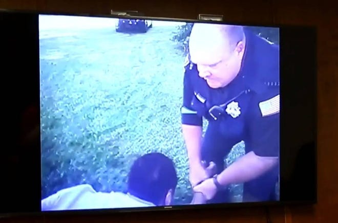A body camera recording shows Dominique White and Topeka police officer Michael Cruse during a struggle on Sept. 28, 2017. [Screenshot]