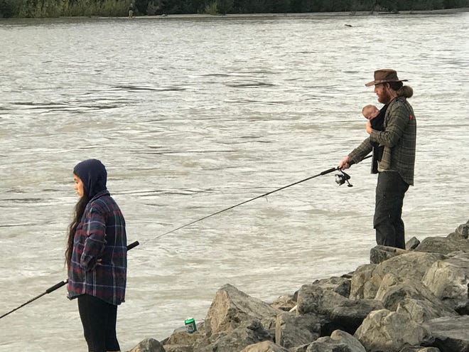 A family fishing outing on Alaska’s Susitna River. This is the time of year Alaskans fill their freezers with salmon for the long winter ahead. [Rick Holmes]