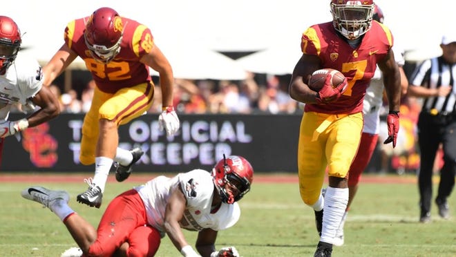 USC running back Stephen Carr picks up a 40-yard gain against UNLV in the second quarter Sept. 1. USC won 43-21. WALLY SKALIJ/LOS ANGELES TIMES