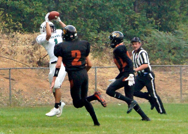 Weed's Angel Nicholas catches a pass during the Cougars' 48-20 win at Dunsmuir Aug. 31. Mt. Shasta Area Newspapers file photo by Dave Sjostedt