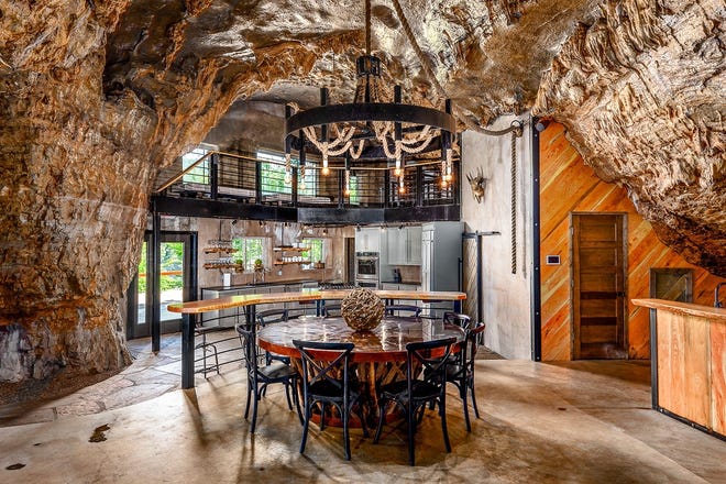 The kitchen and breakfast nook of the Beckham Creek Cave home, built into a massive limestone cave in the Ozark Mountains in Newton County, Arkansas. [PHOTOS COURTESY MALLORY JANE PHOTOGRAPHY www.mallory.gallery