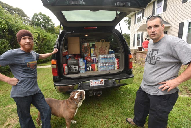 Anthony Linden, right, and Dean Prohaska, left, are driving these and other supplies down to North Carolina to assist with Hurricane Florence relief on Saturday, Sept. 15, 2018. They are seen here in Linden's yard in Dighton on Friday, Sept. 14, 2018. Taunton Gazette photo Mike Gay