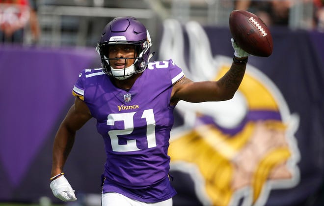 FILE - In this Sept. 9, 2018, file photo, Minnesota Vikings cornerback Mike Hughes celebrates after returning an interception 28-yards for a touchdown during the second half of an NFL football game against the San Francisco 49ers, in Minneapolis. Hughes was forced into a heavy role in his NFL debut by injuries in Minnesota's secondary, and this week the rookie has been preparing to face Green Bay quarterback Aaron Rodgers. There's no easing in for this first-round draft pick. (AP Photo/Bruce Kluckhohn, File)