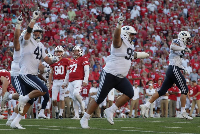 BYU players react after Wisconsin kicker Rafael Gaglianone missed a field goal in the final seconds of the second half of an NCAA college football game Saturday, Sept. 15, 2018, in Madison, Wis. BYU won 24-21. (AP Photo/Morry Gash)
