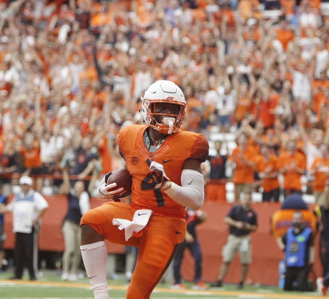 Syracuse's Dontae Strickland dances in the end zone after scoring a touchdown in the fourth quarter of an NCAA college football game against Florida State in Syracuse on Saturday. (AP Photo/Nick Lisi)