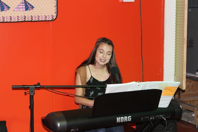 Ruby Tilghman raises money for Many Mini Musicians through a performance at Maddie's La Casita. [contributed photo]