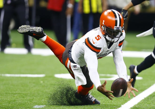 Browns quarterback Tyrod Taylor recovers his own fumble during the second half Sunday against the New Orleans Saints. The Saints won 21-18. [Butch Dill/Associated Press]