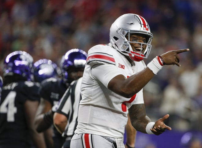 Ohio State quarterback Dwayne Haskins celebrates after throwing a 24-yard touchdown pass to K.J. Hill during the third quarter. Haskins, aided by acting head coach Ryan Day's mix of play calls, passed for 344 yards and two TDs. [Joshua A. Bickel]