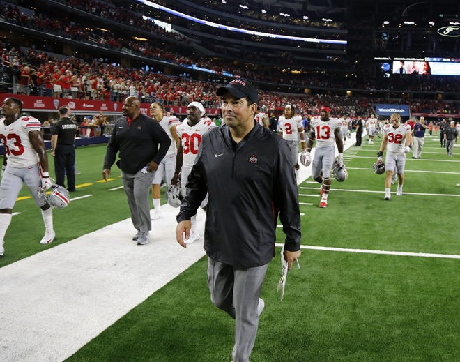 Ohio State acting head coach Ryan Day walks off the field after beating TCU 40-28 at AT&T Stadium. [Kyle Robertson/Dispatch]