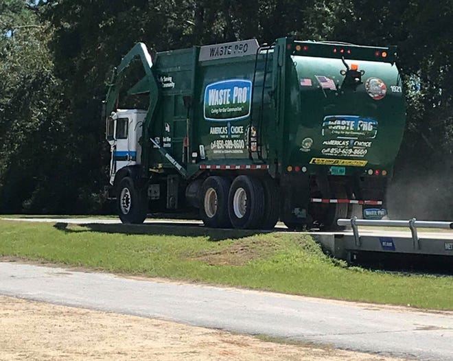 A Waste Pro truck moves along its route recently in Baker. [BRITTNEY SANCHEZ/CONTRIBUTED PHOTO]
